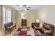 Small office space with comfortable seating and built-in shelving at 42609 W Milky Way, Maricopa, AZ 85138