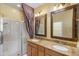 Clean bathroom with double vanity and shower at 42609 W Milky Way, Maricopa, AZ 85138