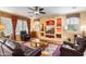 Living room with built-in entertainment center and comfortable seating at 42609 W Milky Way, Maricopa, AZ 85138