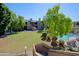 Community view with pool, grass, and trees at 5998 N 78Th St # 208, Scottsdale, AZ 85250