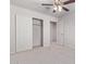 Bedroom with double door closet and carpet at 853 E Agua Fria Ln, Avondale, AZ 85323