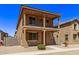 Two story home with balcony and desert landscaping at 853 E Agua Fria Ln, Avondale, AZ 85323
