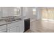 Kitchen with double sink, dishwasher, and wood-look flooring at 853 E Agua Fria Ln, Avondale, AZ 85323