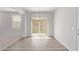Bright dining room with wood flooring and sliding door at 853 E Agua Fria Ln, Avondale, AZ 85323
