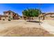 Two-story townhouses with a tree and walkway at 853 E Agua Fria Ln, Avondale, AZ 85323