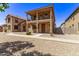 Two-story home with a balcony and Spanish-style architecture at 853 E Agua Fria Ln, Avondale, AZ 85323