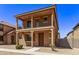 Two story home with balcony and Spanish style architecture at 853 E Agua Fria Ln, Avondale, AZ 85323