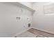 Laundry room with vinyl flooring and built-in shelving at 853 E Agua Fria Ln, Avondale, AZ 85323