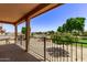 Covered balcony overlooking a playground and community at 853 E Agua Fria Ln, Avondale, AZ 85323