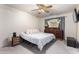 Bright bedroom with a ceiling fan and ample closet space at 1497 S Dove St, Gilbert, AZ 85233