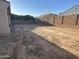 Large backyard with dirt lot and block wall at 14044 W Bronco Trl, Surprise, AZ 85374