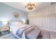 Elegant bedroom with wood accent wall and ensuite bathroom at 11224 E Upton Ave, Mesa, AZ 85212