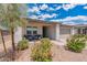 Modern home with gray garage door and landscaped front yard at 11224 E Upton Ave, Mesa, AZ 85212