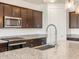 Sleek kitchen with granite countertops and modern fixtures at 37279 W Patterson St, Maricopa, AZ 85138