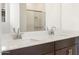 Double vanity bathroom with modern finishes and a large mirror at 37279 W Patterson St, Maricopa, AZ 85138