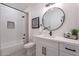 Clean bathroom with herringbone tile shower and modern vanity at 16375 W Windcrest Dr, Surprise, AZ 85374