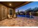 Relaxing covered patio overlooking the pool and backyard at 10718 E Lumiere Ave, Mesa, AZ 85212