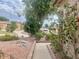 Landscaped front yard with a walkway leading to the entrance at 16416 S 16Th Ln, Phoenix, AZ 85045