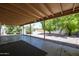 Large backyard with covered patio and gravel landscaping at 2316 E Betty Elyse Ln, Phoenix, AZ 85022