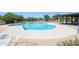 Community pool with ample deck space for lounging at 2316 E Betty Elyse Ln, Phoenix, AZ 85022