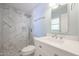 Clean bathroom with walk-in shower and white vanity at 2316 E Betty Elyse Ln, Phoenix, AZ 85022