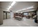 Community room with a library and tables for residents at 2316 E Betty Elyse Ln, Phoenix, AZ 85022