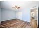Light and airy bedroom with wood-look floors and ample closet space at 2316 E Betty Elyse Ln, Phoenix, AZ 85022