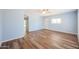 Bedroom with wood flooring and sliding door to patio at 2316 E Betty Elyse Ln, Phoenix, AZ 85022