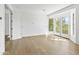 Bedroom with hardwood floors and French doors leading to a patio at 1331 W State Ave, Phoenix, AZ 85021