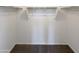 Large walk-in closet with double hanging rods and carpeted floor at 2178 N 212Th Ln, Buckeye, AZ 85396