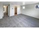 Bright bedroom with carpet flooring and access to hallway and closet at 2178 N 212Th Ln, Buckeye, AZ 85396