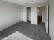 Spacious bedroom featuring a large closet and access to hallway at 2178 N 212Th Ln, Buckeye, AZ 85396