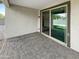 Covered patio with brick pavers and sliding glass door access at 2178 N 212Th Ln, Buckeye, AZ 85396