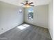 Bright bedroom with carpeted floor and ceiling fan at 2178 N 212Th Ln, Buckeye, AZ 85396