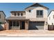 Two-story house with gray siding and a two-car garage at 5888 S Boulder St, Gilbert, AZ 85298