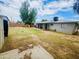 Backyard view of house, shed, and patio at 5919 W Marlette Ave, Glendale, AZ 85301