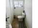 Clean bathroom with toilet, sink, and tile floor at 5919 W Marlette Ave, Glendale, AZ 85301
