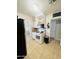 White kitchen with gas range and microwave at 5919 W Marlette Ave, Glendale, AZ 85301