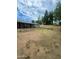 Large backyard with grassy area, patio, and storage shed at 5919 W Marlette Ave, Glendale, AZ 85301