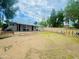 Large backyard with grassy area, patio, and storage shed at 5919 W Marlette Ave, Glendale, AZ 85301