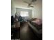 Bedroom with a bed, desk, and gaming chair at 5919 W Marlette Ave, Glendale, AZ 85301