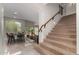 Elegant staircase with wood railing and carpet at 18681 E Apricot Ln, Queen Creek, AZ 85142