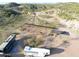 Aerial view of horse stables, RV parking, and a round pen on the property at 51445 N 299Th Ave, Wickenburg, AZ 85390