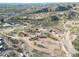 Aerial view of expansive property with multiple structures and surrounding desert landscape at 51445 N 299Th Ave, Wickenburg, AZ 85390