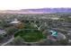 Community overview showcasing expansive green spaces, playground, and clubhouse at 28959 N 124Th Ave, Peoria, AZ 85383