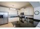 Modern kitchen featuring stainless steel appliances and granite countertops at 28959 N 124Th Ave, Peoria, AZ 85383