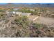 Aerial view of property showing house, surrounding land, and distant mountains at 50644 N 33Rd Ave, New River, AZ 85087