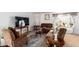 Living room with two armchairs and a large TV at 9431 E Coralbell Ave # 172, Mesa, AZ 85208
