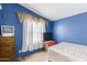 Bedroom with double bed, TV, and dresser at 9431 E Coralbell Ave # 172, Mesa, AZ 85208