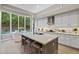 Modern kitchen with large island and white cabinets at 11457 E Blanche Dr, Scottsdale, AZ 85255